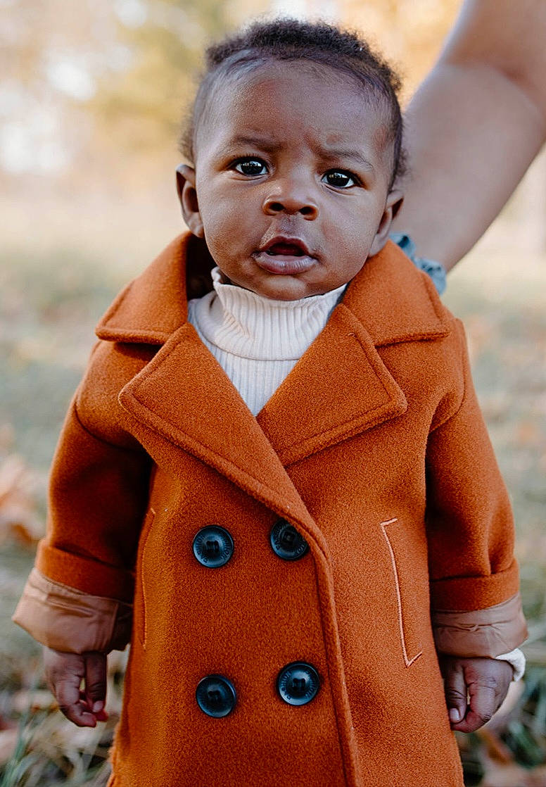 Ezra joined the competition — help win amazing prizes! baby, baby_toddler_clothing, blazer, button, coat, collar, dress, face, fashion, happy, human_body, jacket, jeans, neck, outerwear, person, plant, skin, sleeve, standing
