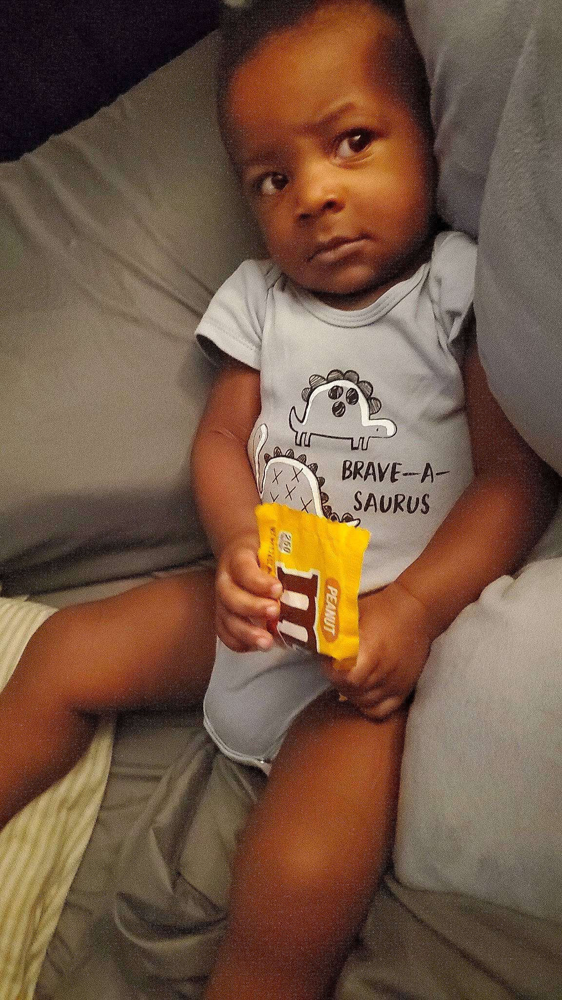 Ezra is registered to the contest to win money with this photo: baby, baby_toddler_clothing, cheek, child, comfort, elbow, face, finger, fun, gesture, happy, head, nail, nose, person, skin, sleeve, smile, t_shirt, thumb