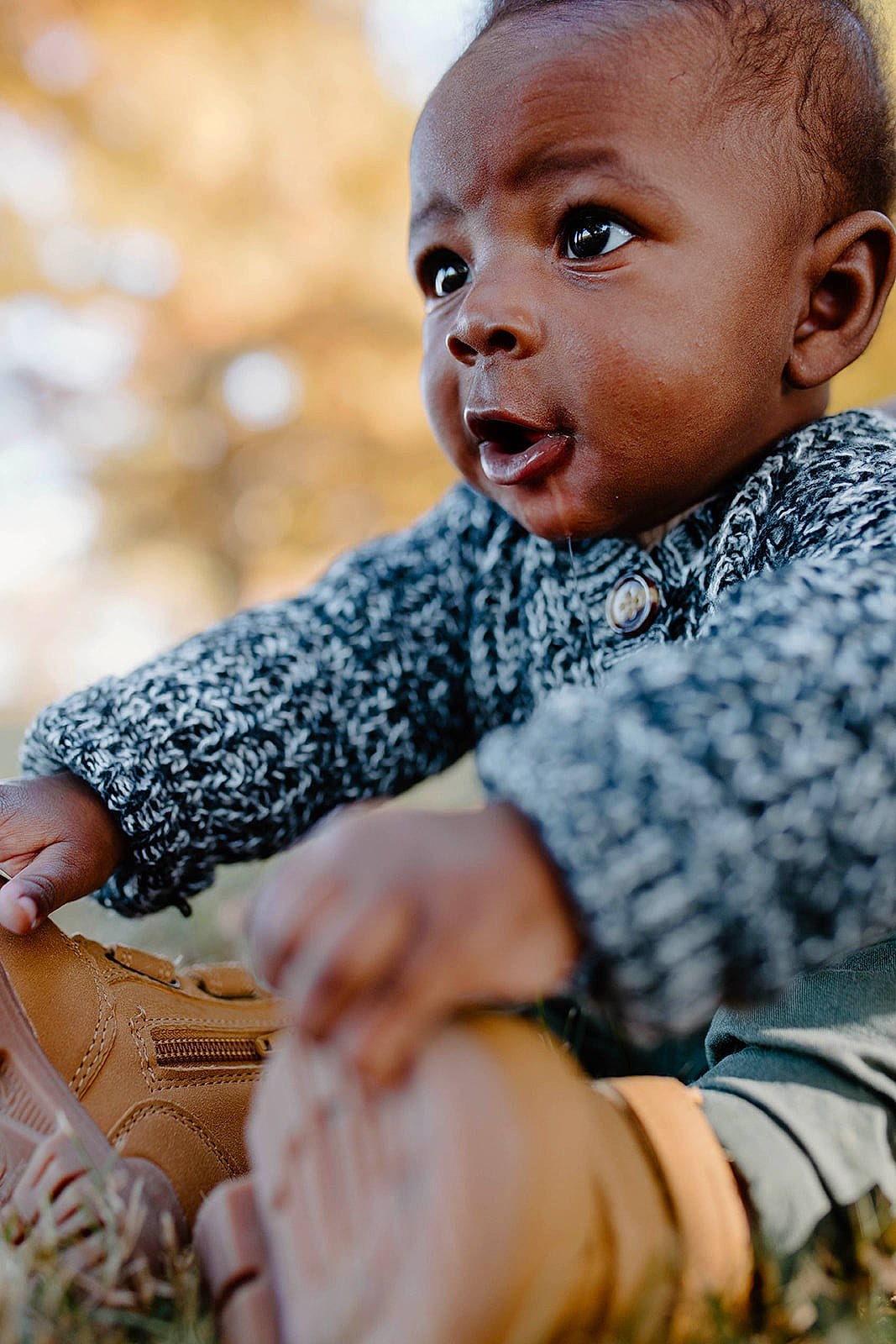 Ezra joined the competition — help win amazing prizes! baby, baby_toddler_clothing, cheek, child, eye, face, facial_expression, flash_photography, fun, grass, happy, head, leisure, pattern, person, sitting, skin, sleeve, smile, toddler