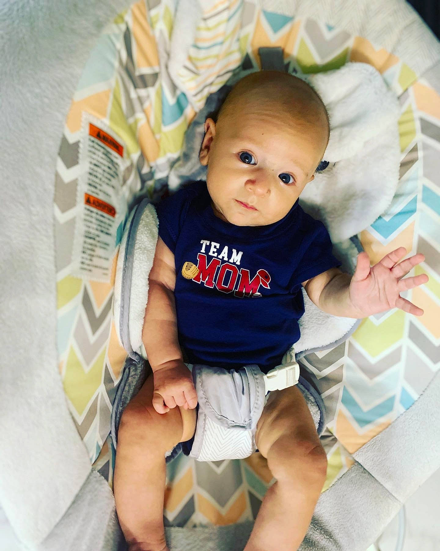 Matthias is registered to the contest to win money with this photo: abdomen, baby, baby_toddler_clothing, cheek, comfort, eye, facial_expression, hairstyle, happy, knee, person, product, shorts, skin, sleeve, sock, t_shirt, thigh, toddler, trunk