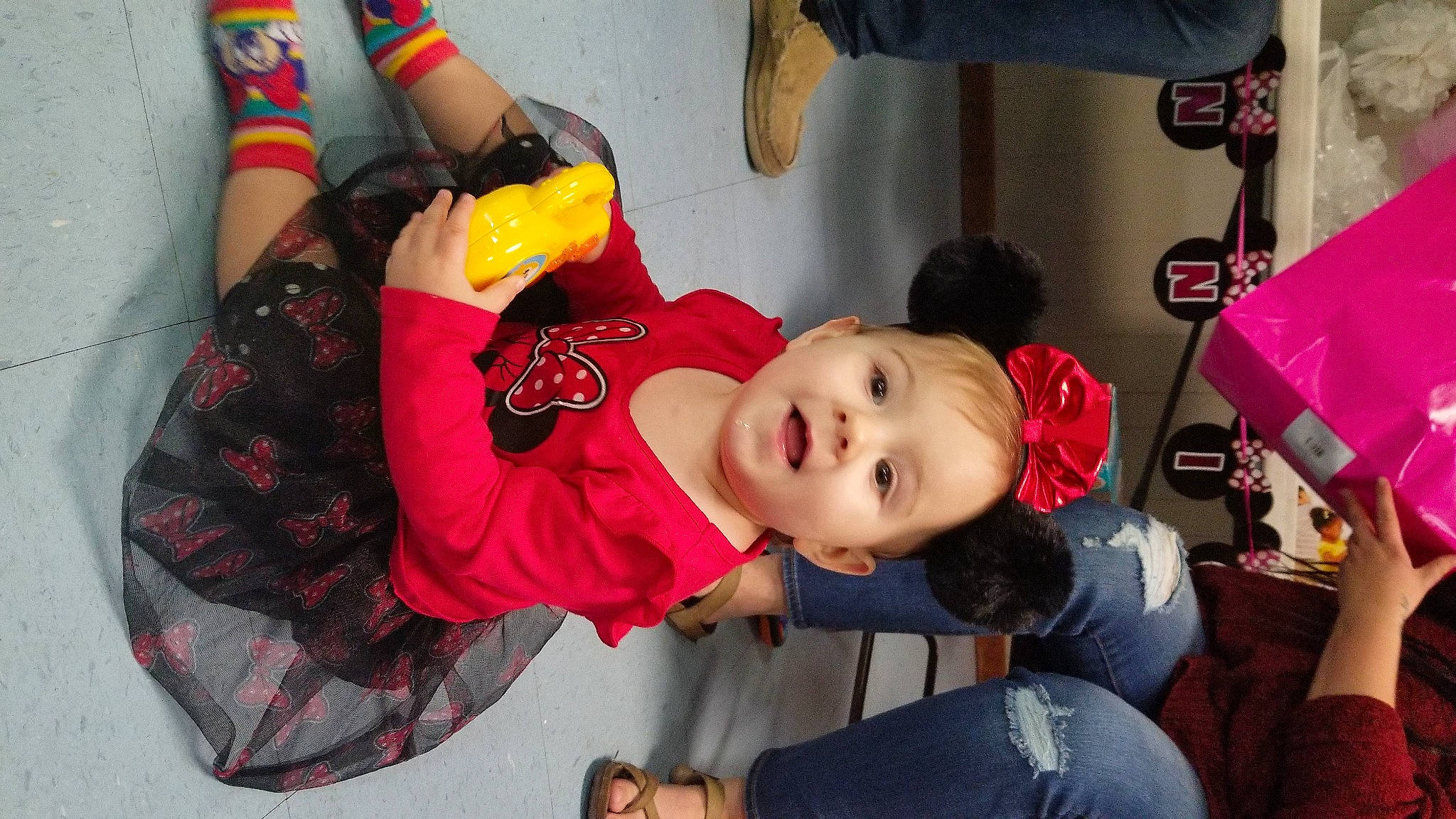Ashtyn is registered to the contest to win money with this photo: baby, baby_toddler_clothing, carmine, child, costume, event, fictional_character, fun, happy, hat, pattern, person, personal_protective_equipment, plaid, play, room, shoe, sitting, smile, tartan