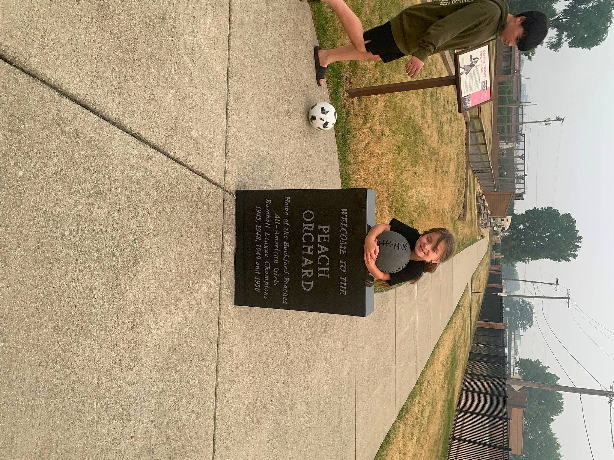 Lennox is registered to the contest to win money with this photo: architecture, building, concrete, facade, font, handwriting, joy, metal, person, plant, sky, tree, wood