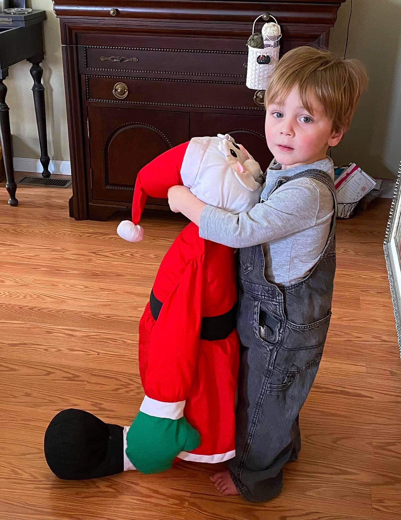 Martin is registered to the contest to win money with this photo: baby, baby_toddler_clothing, cabinetry, carmine, chest_of_drawers, comfort, drawer, event, floor, flooring, fun, hardwood, human_leg, joint, knee, lap, person, sitting, sock, toddler