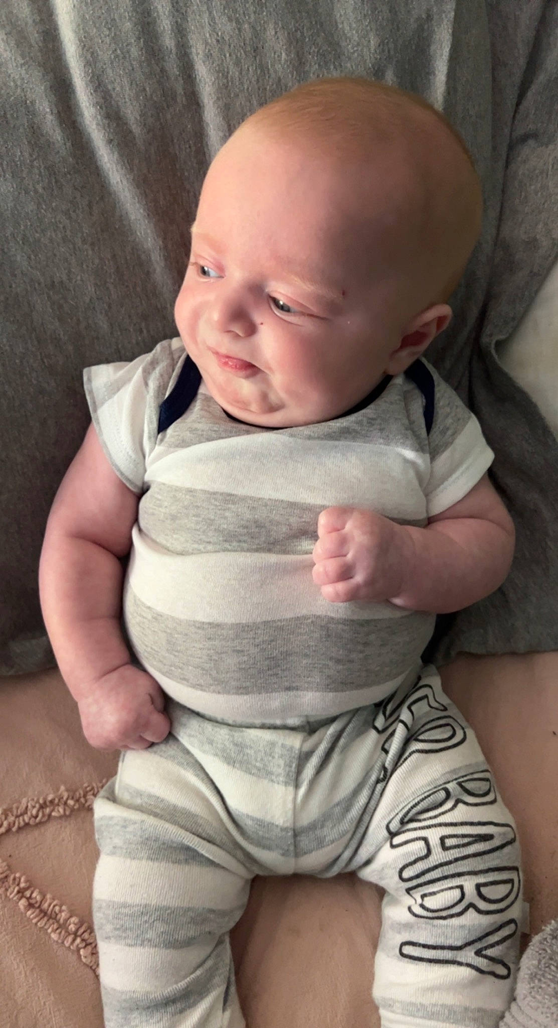 Paxton is registered to the contest to win money with this photo: arm, baby, baby_toddler_clothing, cheek, comfort, eye, head, human, human_body, joint, lip, mammal, mouth, neck, nose, person, product, skin, sleeve, smile