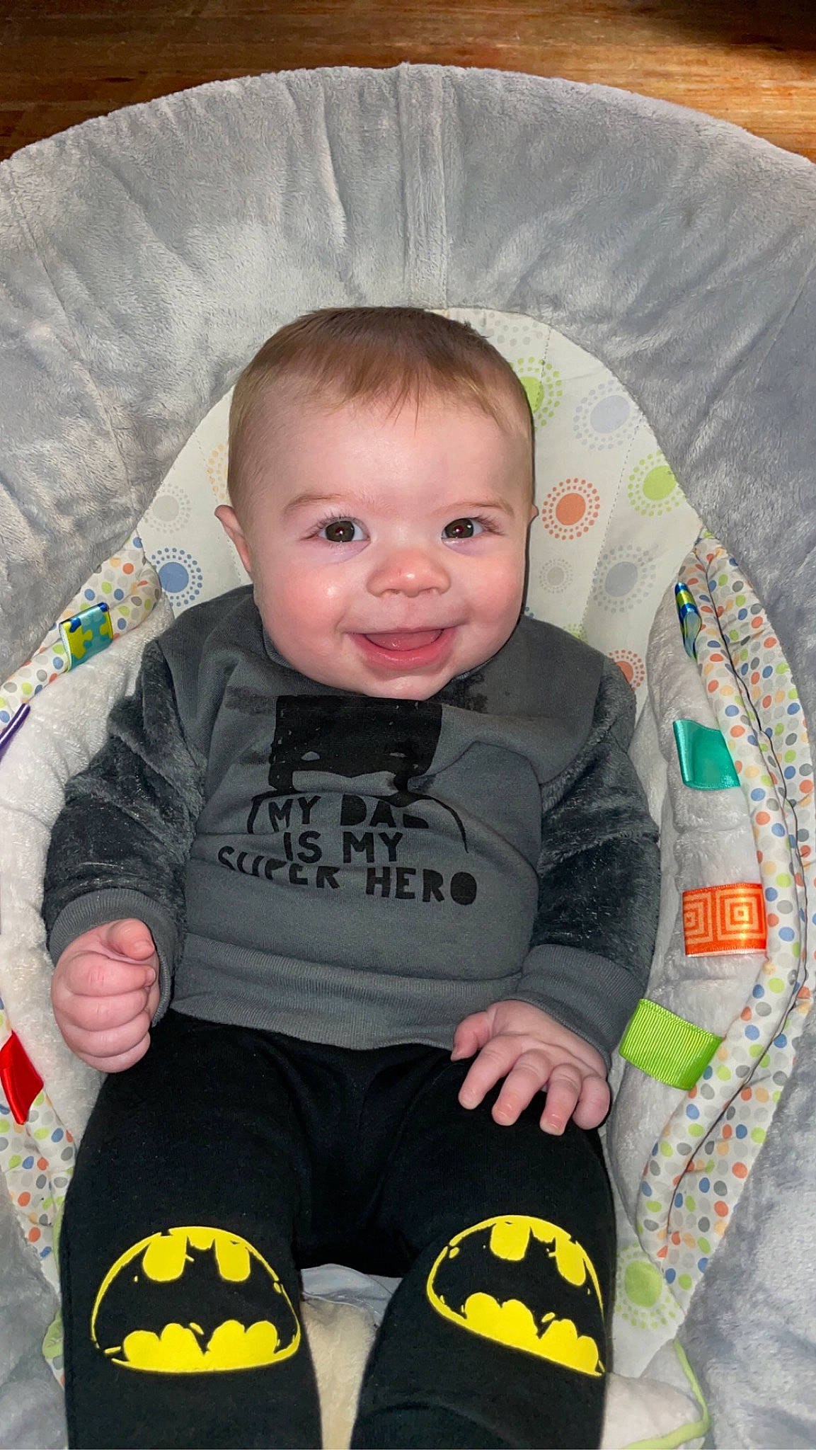 Kayson is registered to the contest to win money with this photo: baby, baby_toddler_clothing, black, cheek, clothing, comfort, eye, facial_expression, head, iris, joy, mammal, organ, outerwear, person, product, skin, sleeve, smile, textile