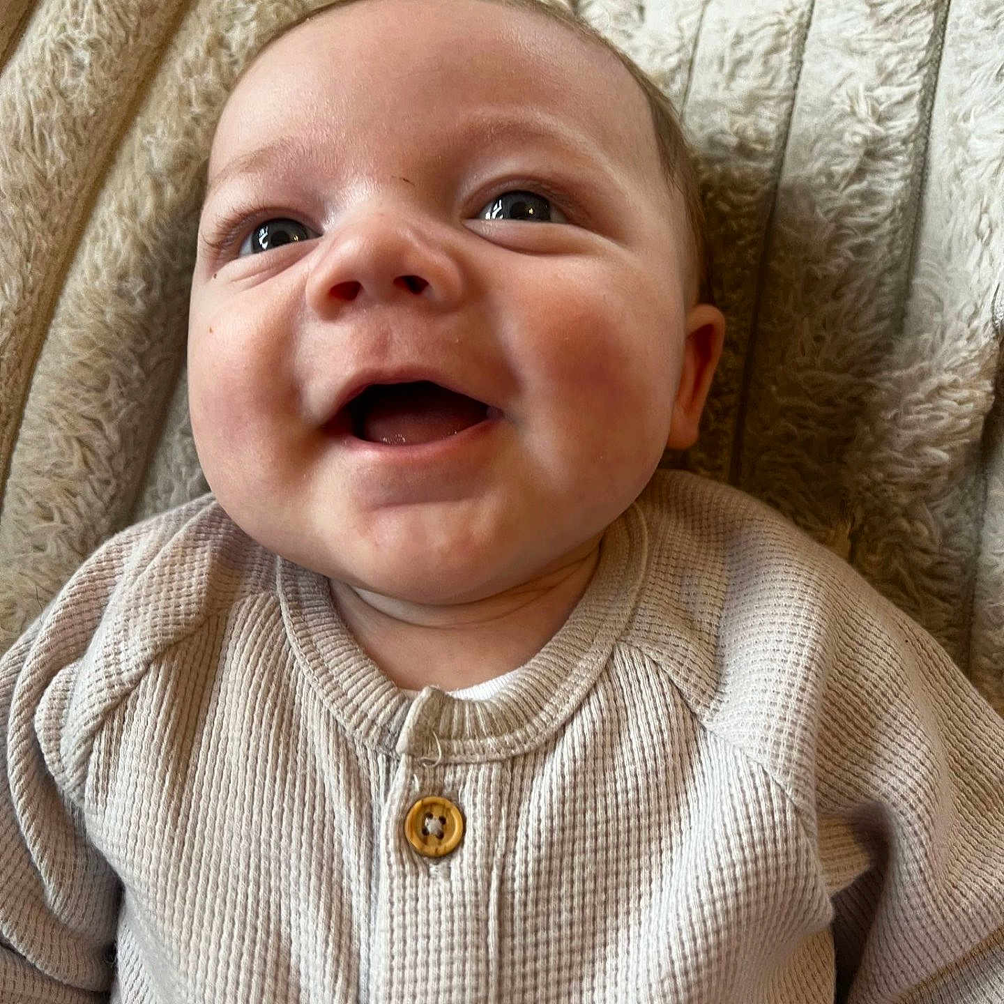Reive is registered to the contest to win money with this photo: baby, babylaughing, clothing, face, happy, head, knitwear, laughing, newborn, person, photography, portrait, smile, sweater