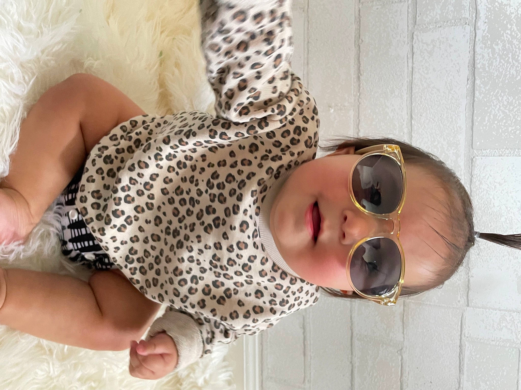 Achilles is registered to the contest to win money with this photo: baby, baby_toddler_clothing, eye, eyewear, face, fawn, glasses, goggles, hand, head, headgear, human_body, nail, nose, pattern, person, sunglasses, thigh, toddler, waist