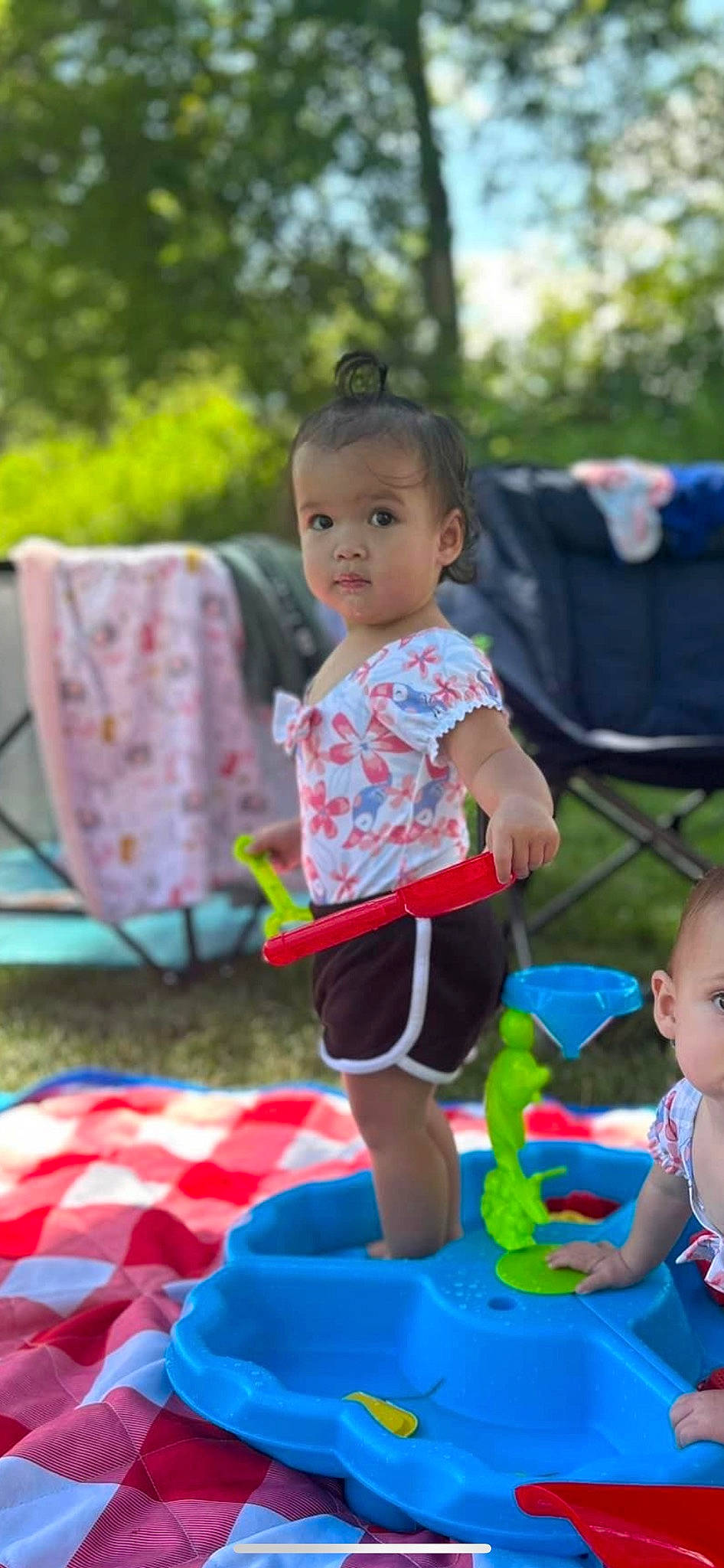 Amiyah joined the competition — help win amazing prizes! baby, baby_toddler_clothing, blue, child, event, facial_expression, fun, grass, happy, head, leisure, people, person, play, public_space, recreation, shorts, sitting, summer, t_shirt