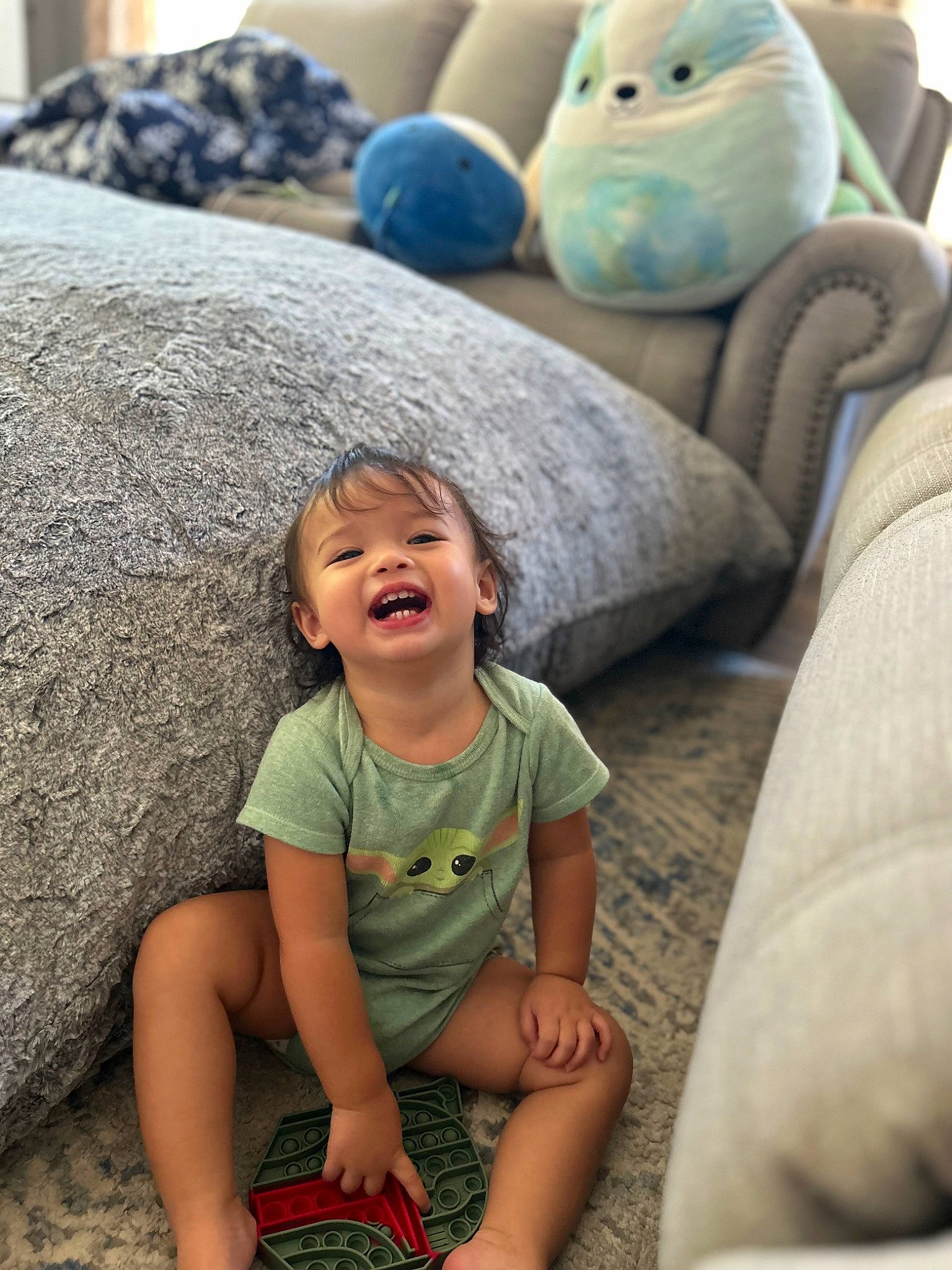 Amiyah is registered to the contest to win money with this photo: baby, baby_toddler_clothing, blue, child, comfort, fun, grass, green, happy, leisure, mammal, person, photograph, shorts, sitting, skin, smile, snapshot, toddler, toy