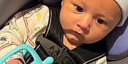 Xzavier joined the competition — help win amazing prizes! baby, infant, newborn, car_seat, seat_belt, buckle, beanie, hat, toy, silicone_toy, hand, onesie, striped_clothing, close_up, portrait, indoor, fabric, warning_label, seat_cushion, strapped