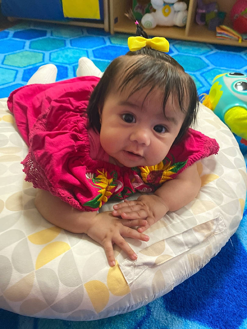 Allyson is registered to the contest to win money with this photo: baby, baby_products, baby_toddler_clothing, blue, child, comfort, flooring, fun, happy, iris, leisure, linens, pattern, person, play, recreation, room, sitting, toddler, tummy_time