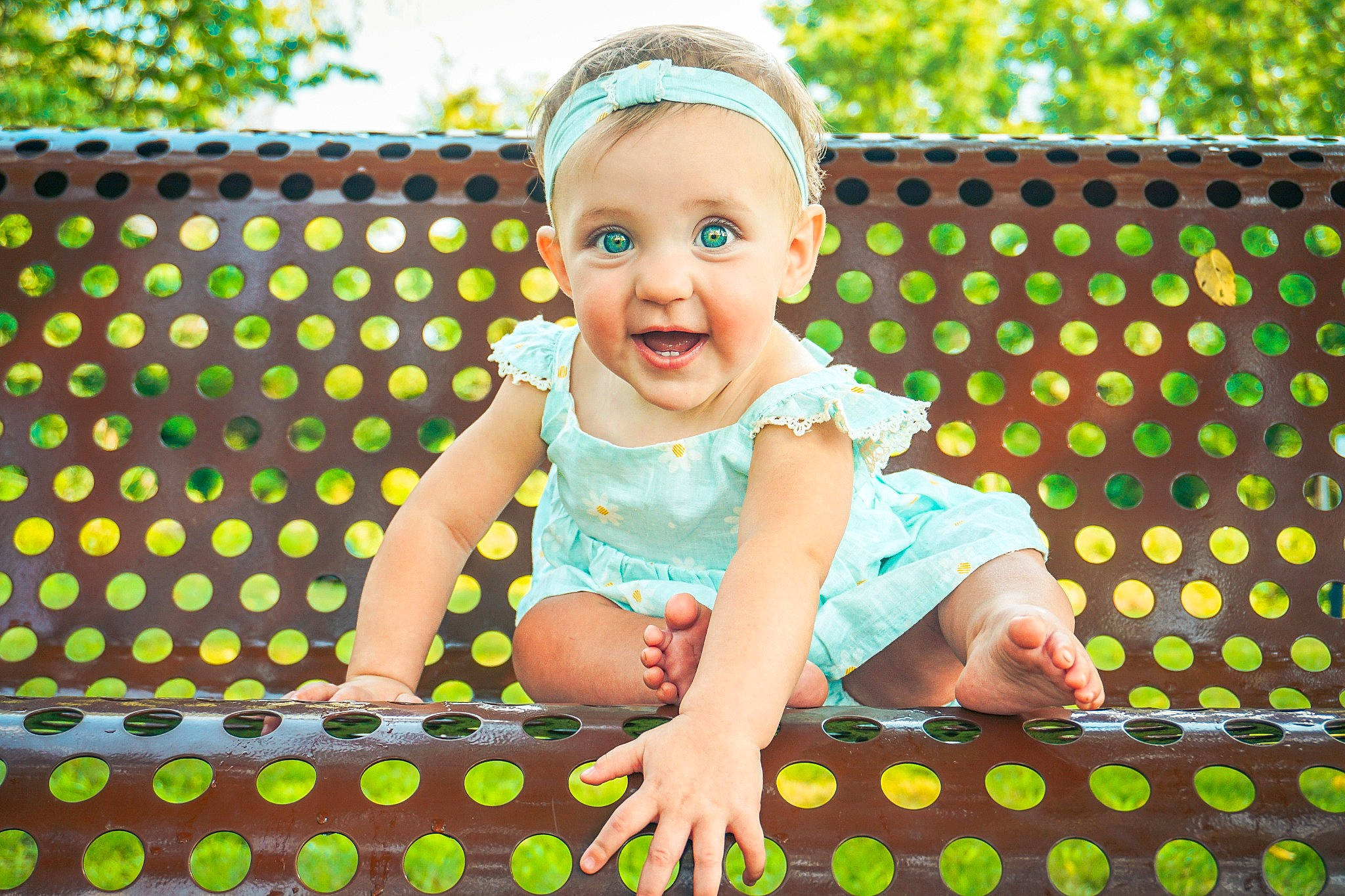 Jaelynn is registered to the contest to win money with this photo: baby, baby_toddler_clothing, child, event, fun, grass, green, happy, hat, leisure, pattern, person, play, sitting, sky, sleeve, smile, textile, toddler, tree