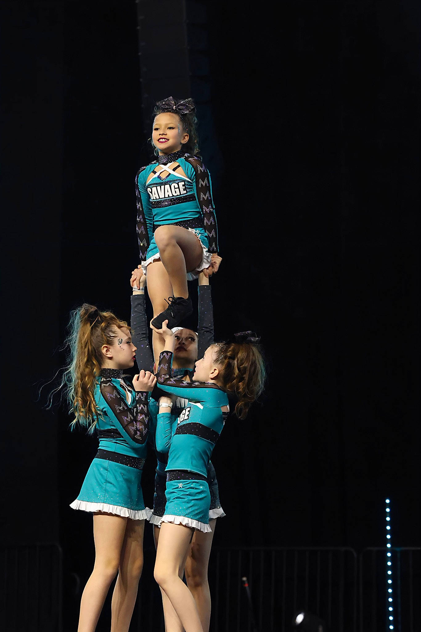 Annie is registered to the contest to win money with this photo: acrobatics, cheerleading, cheerleading_uniform, choreography, competition, competition_event, dance, dancer, electric_blue, entertainment, event, fashion_design, flash_photography, fun, human_leg, joy, performance_art, performing_arts, person, sports