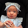 Delilah is registered to the contest to win money with this photo: baby, infant, blue_eyes, striped_clothing, headband, bow, hands, curious_expression, closeup, portrait, child, cute, soft_skin, sitting, clothing, fashion, adorable, person, indoor, young_child