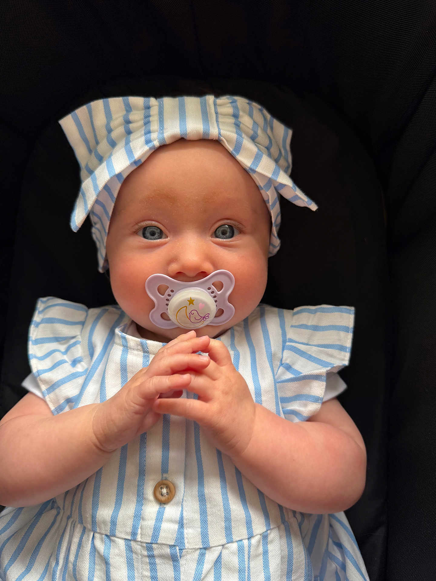 Delilah joined the competition — help win amazing prizes! baby, child, blue_eyes, pacifier, striped_clothing, headband, hands, cute, portrait, infant, sitting, closeup, face, skin, apparel, indoor, adorable, young, human, person