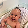 baby, bathtub, foam, towel, smile, happy, child, skin, hand, tattoo, water, bath, person, cute, blue_eyes, wet_hair, infant, bathroom, expression, playful