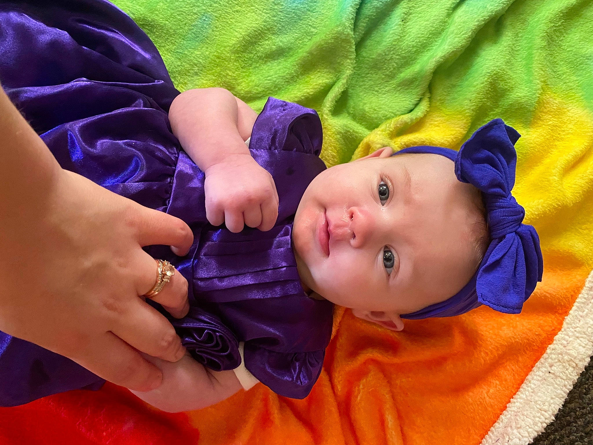 Emberleigh is registered to the contest to win money with this photo: baby, baby_toddler_clothing, cheek, clothing, eye, face, finger, fun, gesture, hand, happy, head, iris, lip, nose, person, pink, purple, skin, toddler