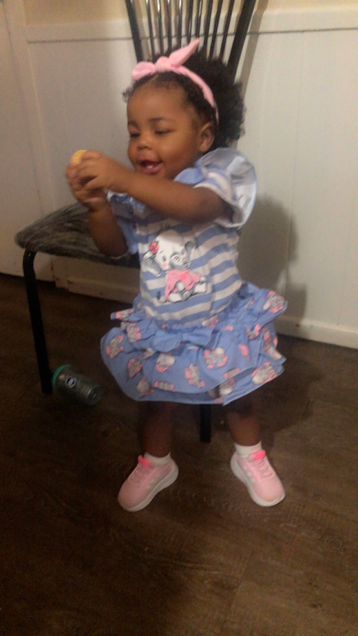 Kamiyah is registered to the contest to win money with this photo: arm, baby, baby_toddler_clothing, dress, face, flooring, footwear, fun, hair, happy, head, iris, magenta, person, pink, purple, sandal, skin, sleeve, smile