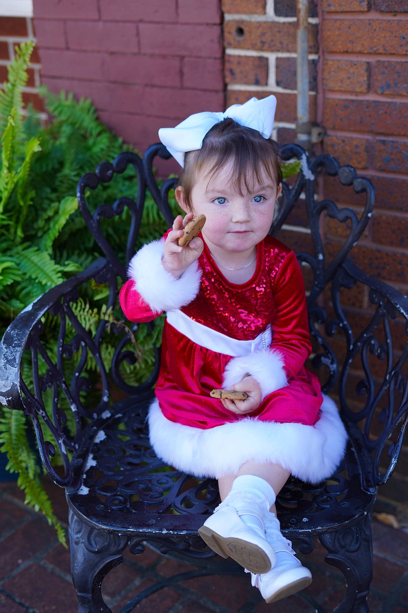 Raven is registered to the contest to win money with this photo: baby_toddler_clothing, child, costume, event, eye, facial_expression, fun, grass, happy, hat, lap, magenta, outerwear, person, plant, purple, sitting, sleeve, smile, tire