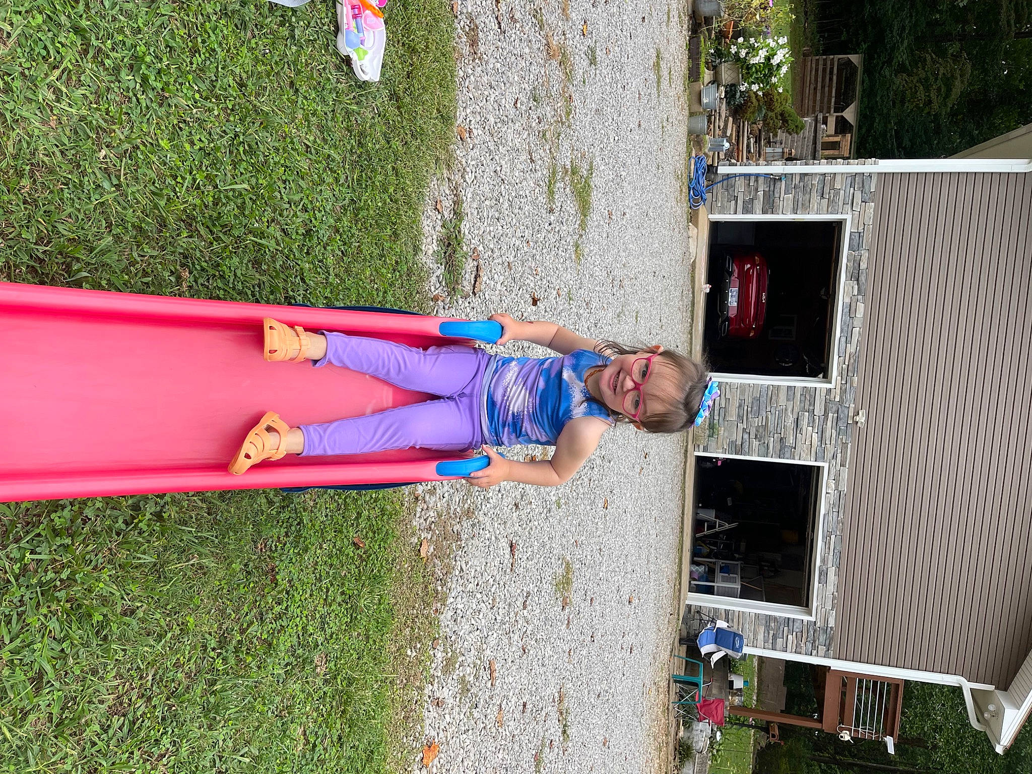 Raven is registered to the contest to win money with this photo: child, electric_blue, fun, grass, joy, leisure, magenta, people_in_nature, person, plant, recreation, t_shirt, toddler, tree, wood