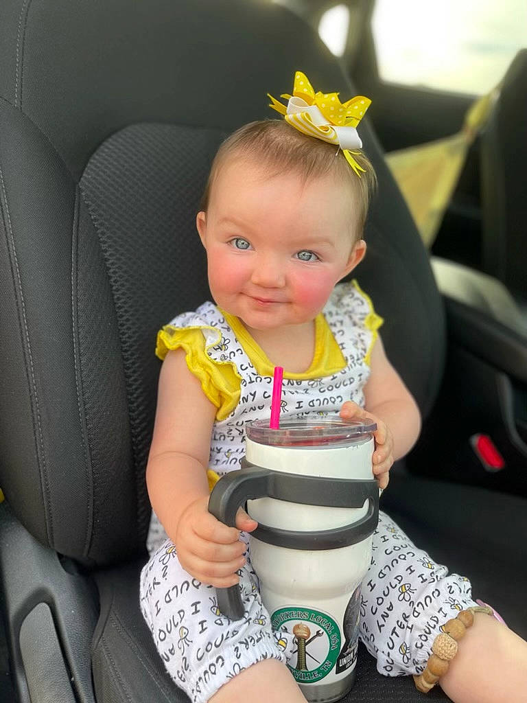 Raven joined the competition — help win amazing prizes! arm, auto_part, baby, baby_toddler_clothing, chair, child, clothing, comfort, eye, finger, flower, fun, grass, happy, knee, person, plant, sitting, skin, thigh