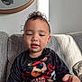 Datu joined the competition — help win amazing prizes! toddler, child, curly_hair, black_shirt, bear_graphic, sunglasses, red_bandana, couch, striped_couch, indoor, sunlight, portrait, smiling, cute, young_child, person, casual_clothing, living_room, happy, seated