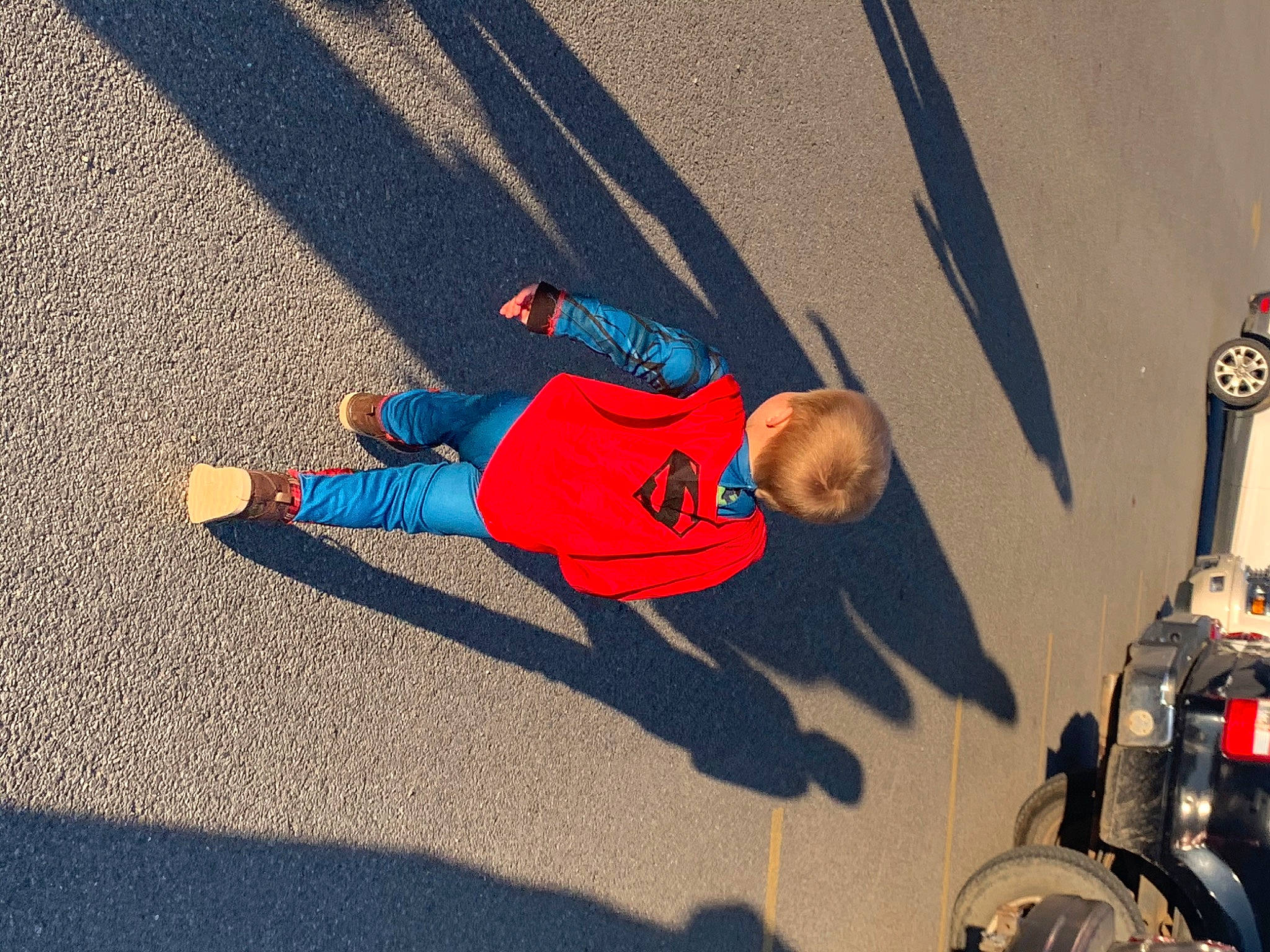 Deacon is registered to the contest to win money with this photo: asphalt, person, red, road, vehicle