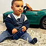 Zayaan joined the competition — help win amazing prizes! toddler, child, indoor, car_toy, rug, smartphone, clothing, sitting, cute, curious, person, footwear, cardigan, pants, toy_car, floor, portrait, young_child, home, play