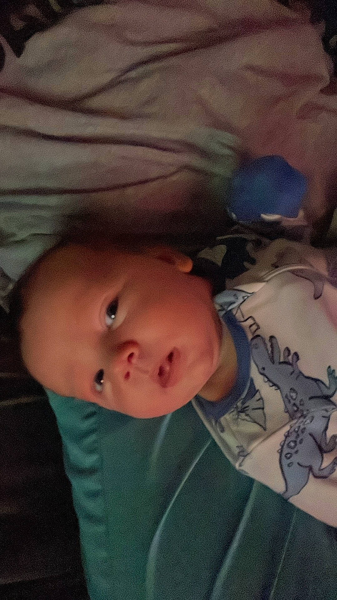 Bryson is registered to the contest to win money with this photo: baby, baby_toddler_clothing, cheek, child, chin, cloud, comfort, cool, eye, eyebrow, forehead, linens, mouth, nose, pattern, person, skin, sleeve, textile, tints_and_shades