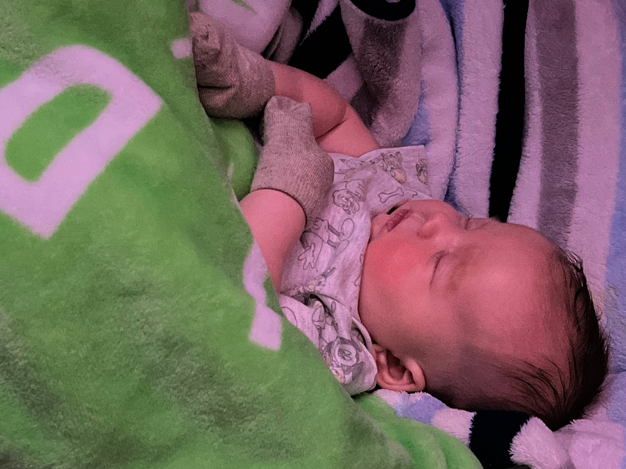 Bryson is registered to the contest to win money with this photo: baby, baby_products, baby_sleeping, baby_toddler_clothing, bedding, bedtime, cheek, child, comfort, finger, grass, hand, linens, mouth, pattern, person, pink, skin, sleeve, textile