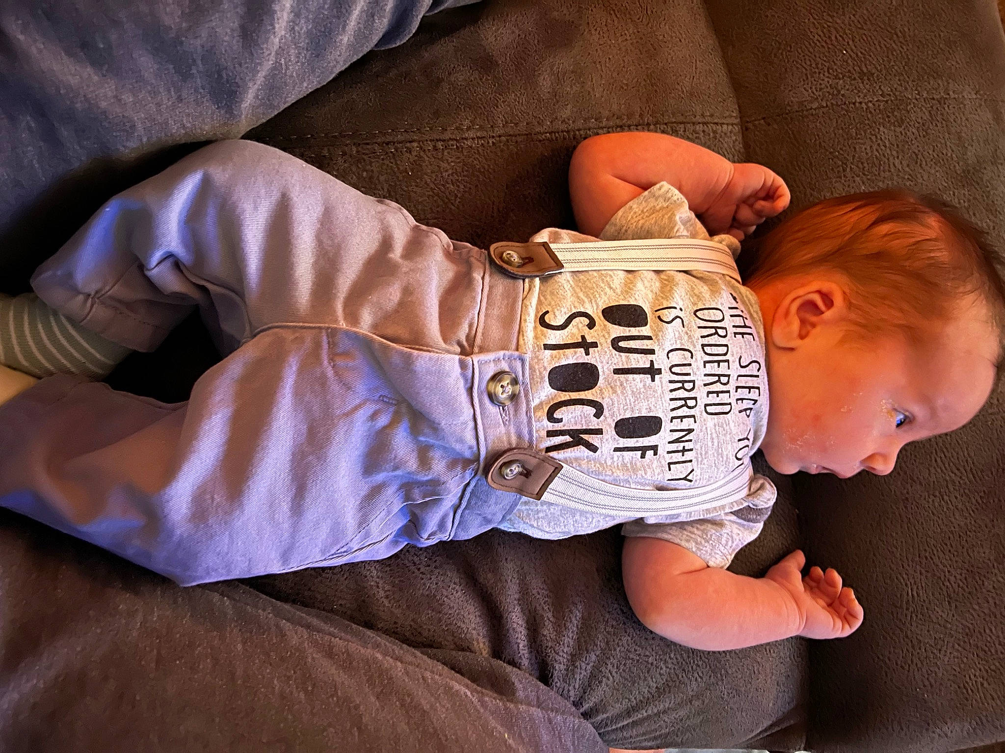Bryson is registered to the contest to win money with this photo: baby, baby_sleeping, baby_toddler_clothing, chin, comfort, cool, elbow, finger, hand, leg, linens, mouth, nose, person, sitting, sleeve, t_shirt, thigh, toddler, wood
