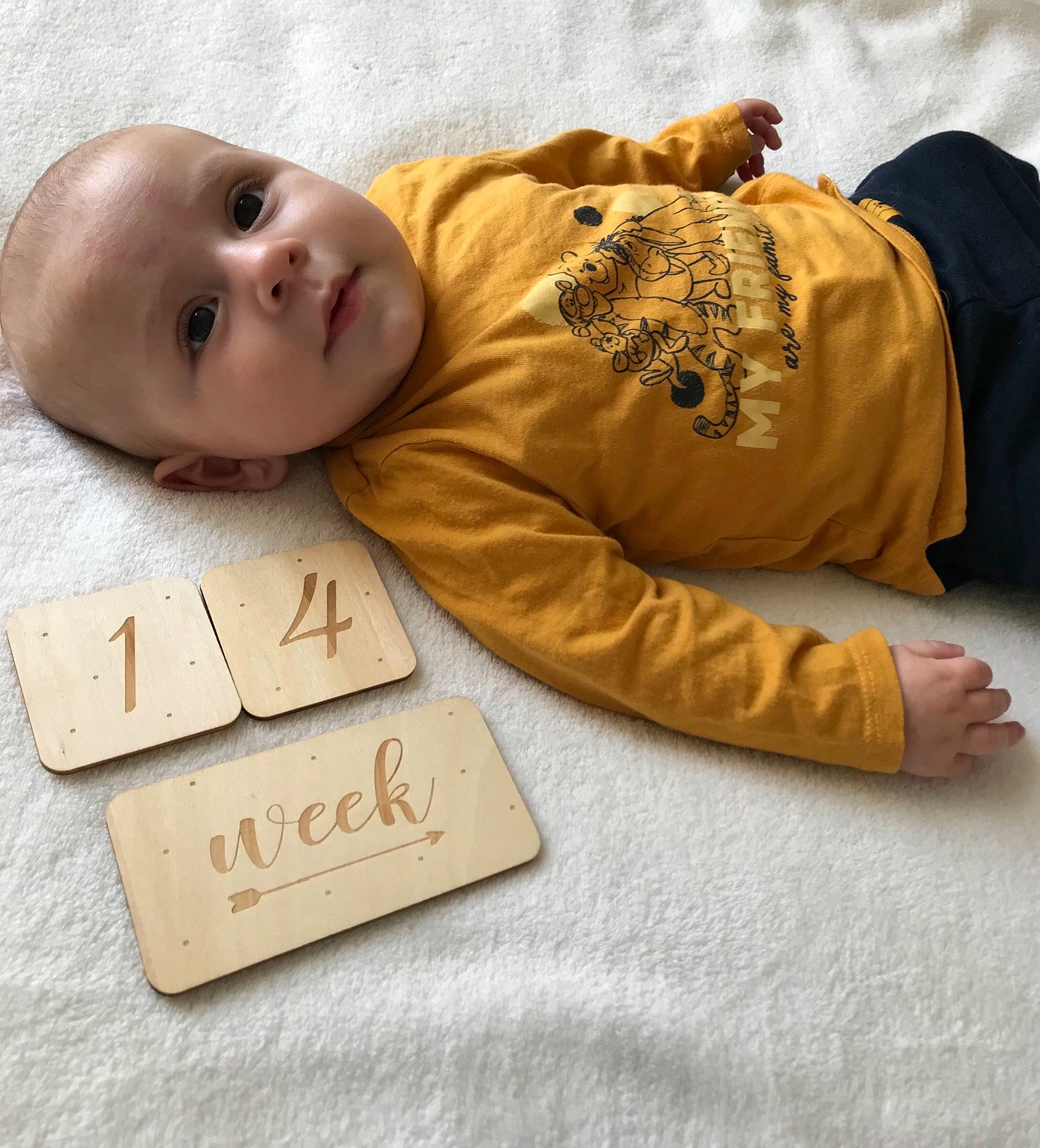 Soën participe au concours pour gagner de l'argent avec cette photo : baby, baby_toddler_clothing, child, comfort, face, finger, flooring, font, fur, happy, linens, mammal, person, photo_caption, rectangle, sitting, skin, sleeve, smile, toddler