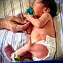 Sophia is registered to the contest to win money with this photo: newborn, baby, sleeping, pacifier, diaper, hand, finger, hospital, blanket, striped, skin, infant, cute, rest, peaceful, person, foot, hospital_band, lying_down, closeup