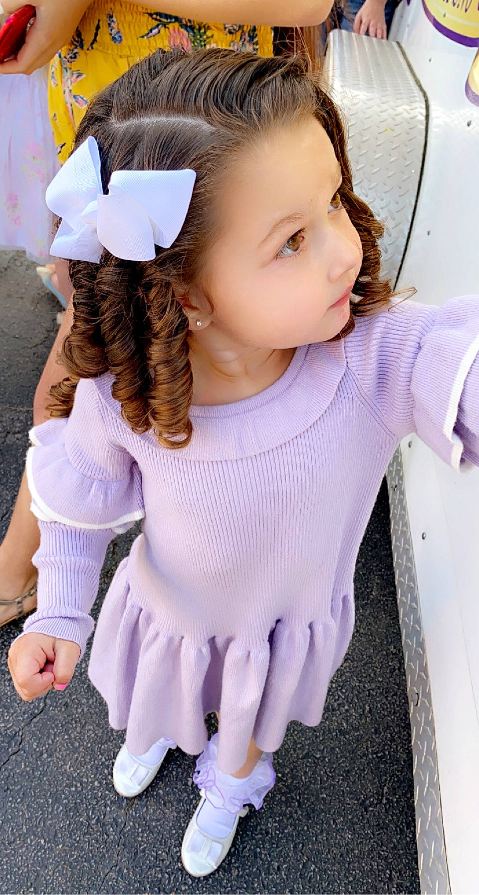 Emilia is registered to the contest to win money with this photo: baby_toddler_clothing, child, eyelash, fashion_design, finger, gesture, hair_accessory, happy, headgear, jewellery, joint, long_hair, neck, pattern, person, pink, shoulder, skin, sleeve, white