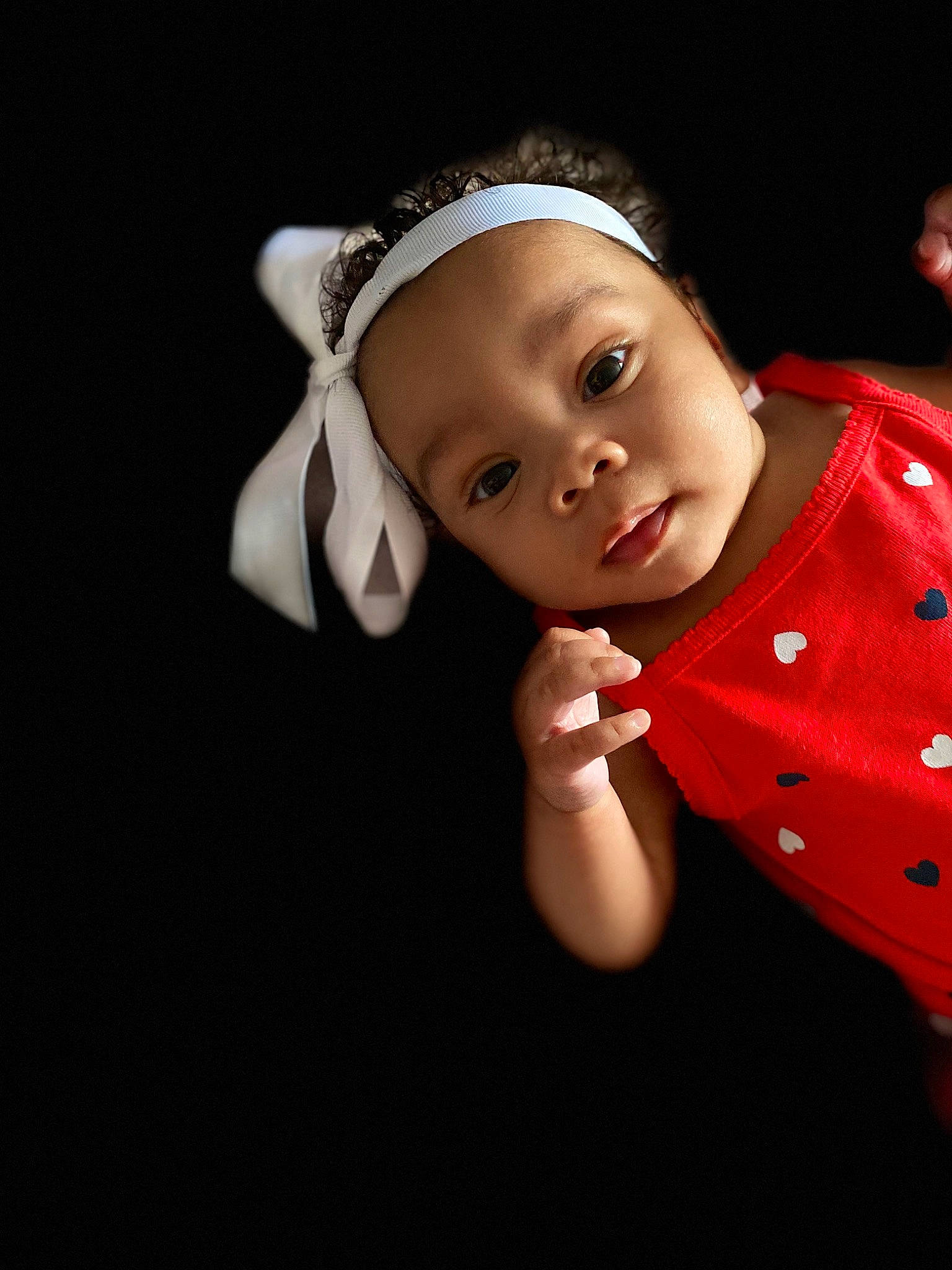 Jae'Laa is registered to the contest to win money with this photo: baby, beauty, cheek, child, child_model, ear, face, flash_photography, hair_accessory, head, headband, headpiece, lip, person, photography, portrait_photography, red, skin, smile, toddler