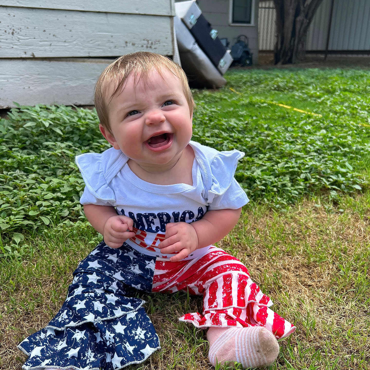Cambreigh joined the competition — help win amazing prizes! baby, child, cute, grass, greenery, happy, house, infant, nature, outdoor, pants, person, shirt, smiling, sock, stars, stripes, tree, window, yard