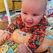 Rosa participe au concours pour gagner de l'argent avec cette photo : baby, bright_colors, child, colorful_clothing, cushion, cute, developmental_toy, early_childhood, face, floor, hand, happy, indoor, infant, person, play, playmat, smile, toy, young_child