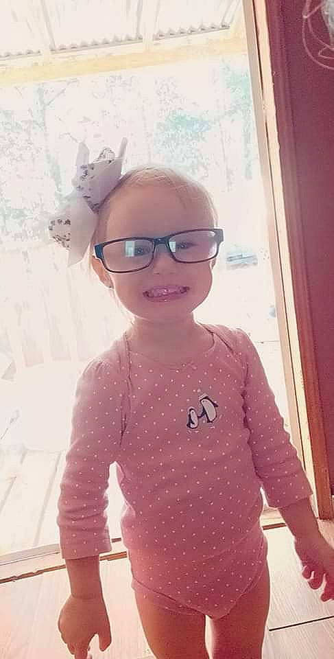 Kaisley-grace is registered to the contest to win money with this photo: baby_toddler_clothing, chin, clothing, dress, eye, eyewear, face, glasses, hair, happy, head, iris, joy, lip, outerwear, person, pink, skin, sleeve, smile