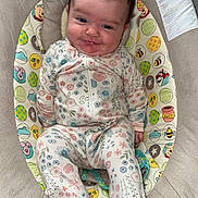 Everleigh is registered to the contest to win money with this photo: baby, infant, onesie, smiling, cute, plush_seat, disney, cartoon, bear_ears, child, patterned_clothing, happy, indoor, soft_texture, comfortable, seated, portrait, young_child, colorful, baby_seat