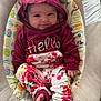 Everleigh joined the competition — help win amazing prizes! baby, child, hoodie, floral_pants, smile, baby_seat, cushion, bear_ears, foot, bandage, indoor, cute, infant, clothing, playful, comfort, happy, person, portrait, seated