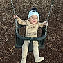Austin joined the competition — help win amazing prizes! baby, child, swing, playground, wood_chips, pajamas, hat, panda_hat, chains, smiling, happy, outdoor, seat, fun, infant, cute, play, person, winter_clothing, park