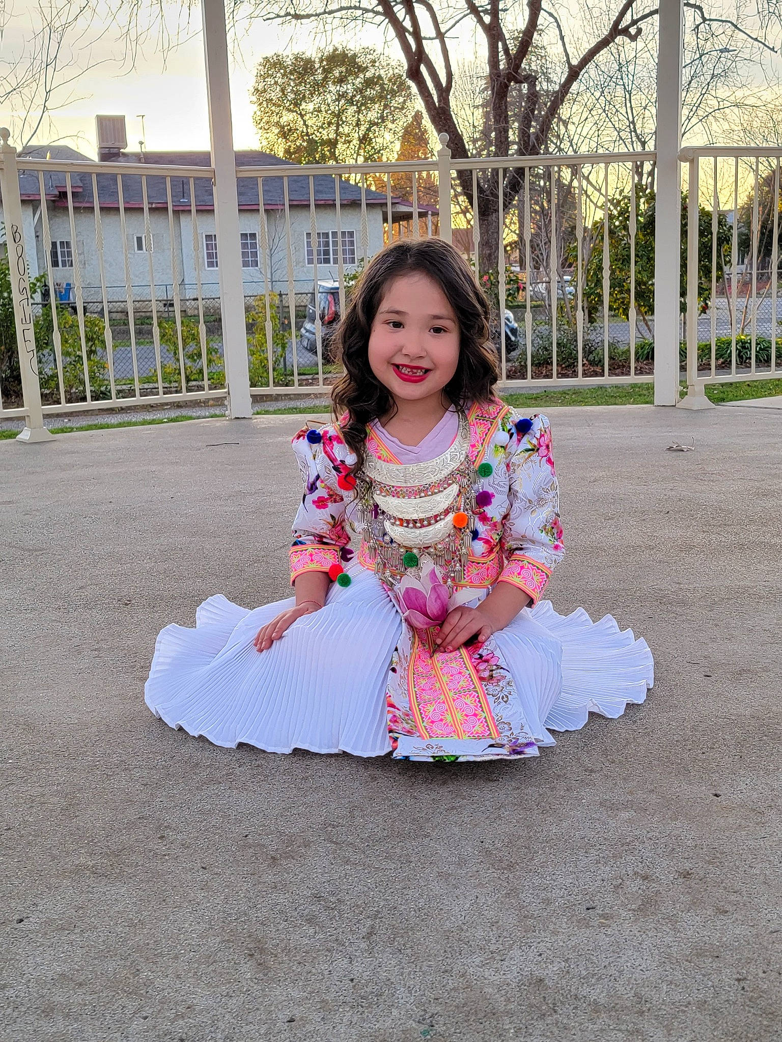 Lyla joined the competition — help win amazing prizes! day_dress, dress, formal_wear, fun, grass, happy, human_leg, joy, leisure, long_hair, magenta, pattern, people_in_nature, person, pink, plant, recreation, sitting, sleeve, smile