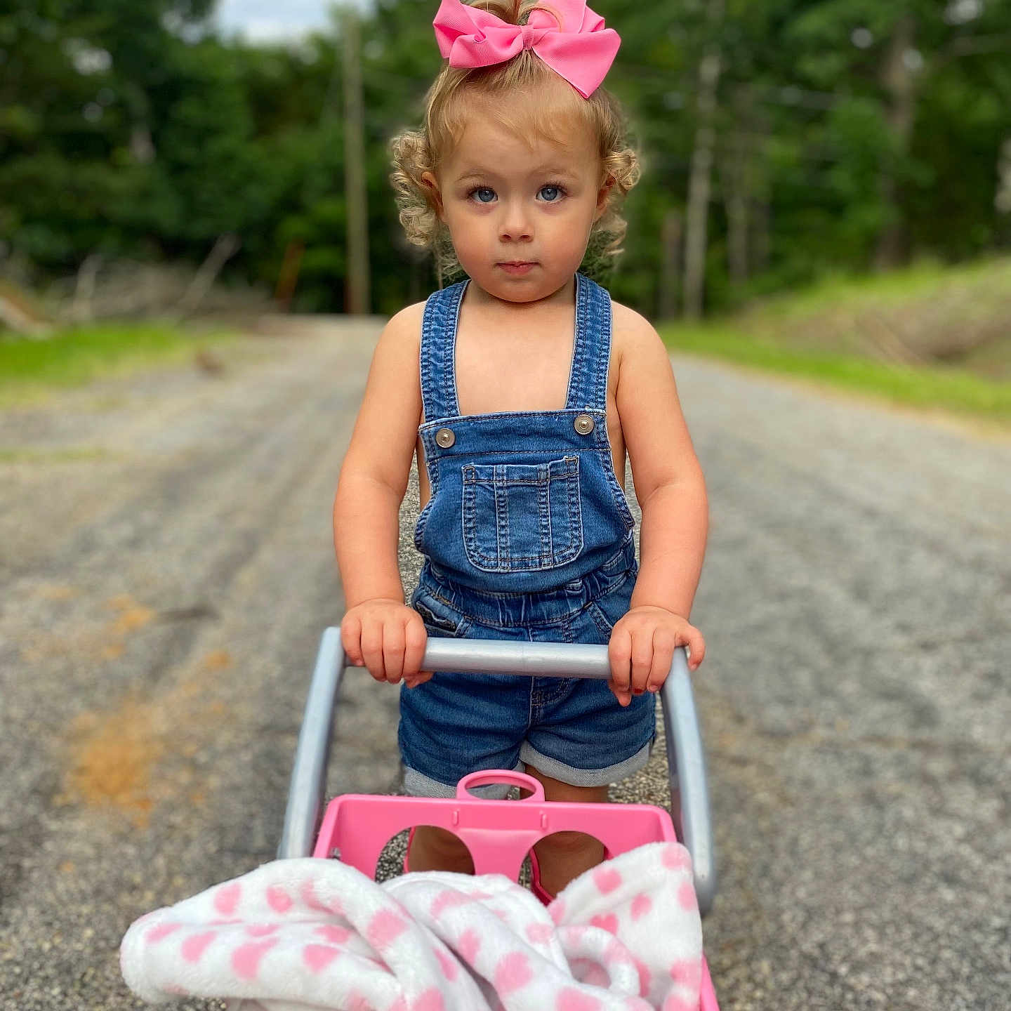 Brinnleigh is registered to the contest to win money with this photo: baby, city, clothing, dress, face, grass, head, jeans, outdoors, pants, person, photography, plant, portrait, road, street, tree, urban, vegetation, walking