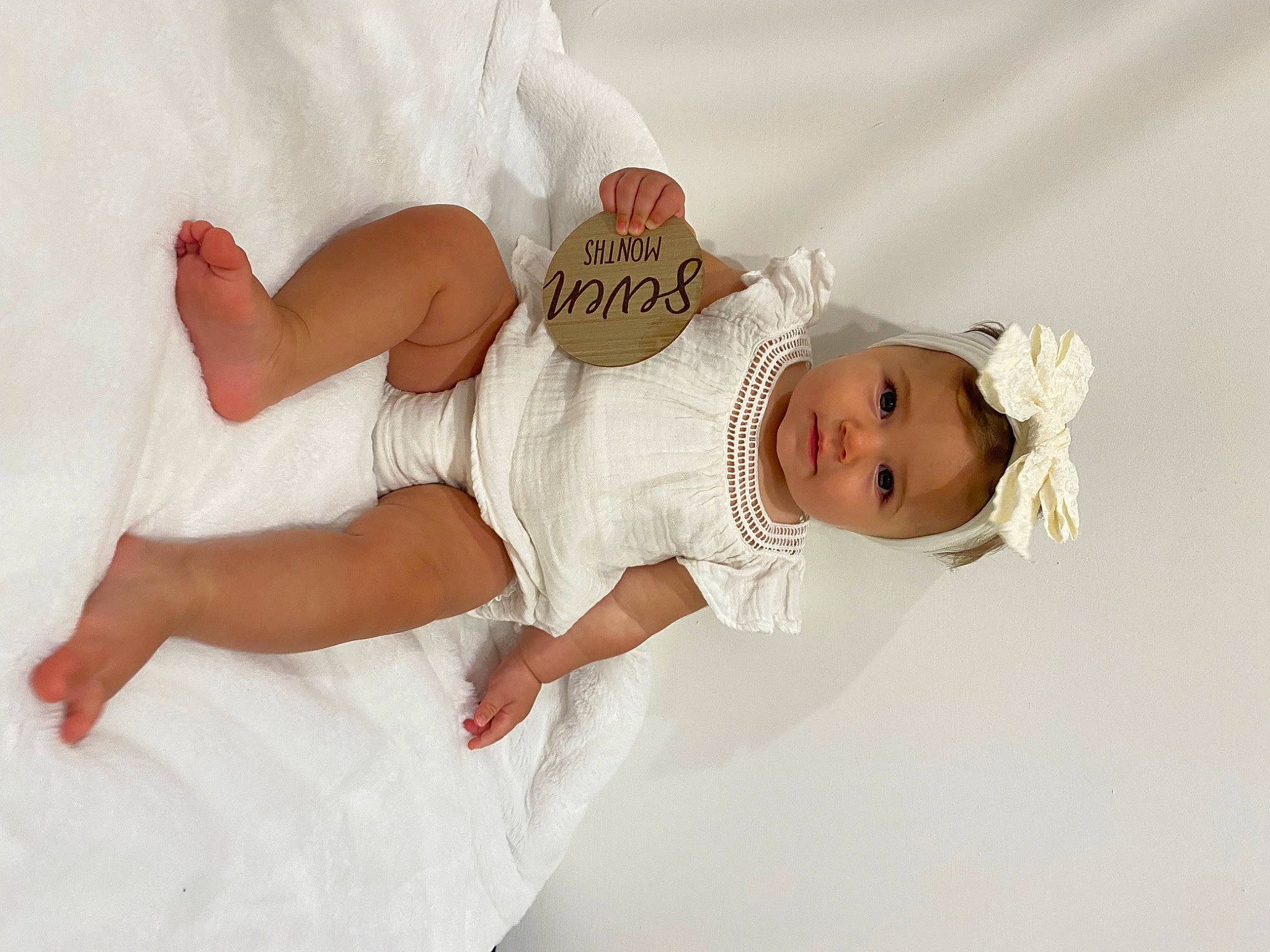 Lainey joined the competition — help win amazing prizes! baby, baby_toddler_clothing, bridal_accessory, child, comfort, dress, elbow, embellishment, fashion_accessory, finger, flash_photography, gesture, hair_accessory, happy, pattern, person, skin, sleeve, smile, toddler