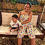 Harena a rejoint le concours — aidez-le/la à gagner de superbes lots ! woman, toddler, child, bench, cushion, plants, brick_wall, pebbles, outdoor, smile, colorful_clothing, socks, sitting, happy, portrait, casual, family, holding, hair_up, jumpsuit