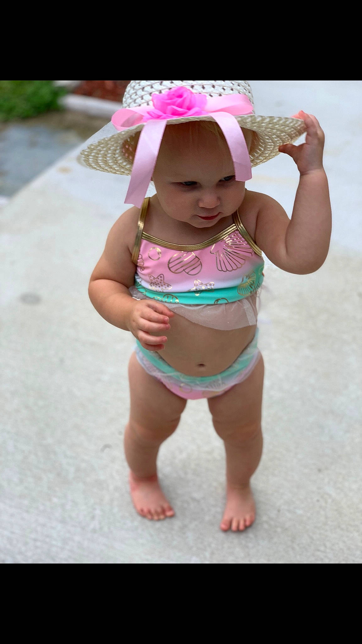Avalynn is registered to the contest to win money with this photo: baby, baby_toddler_clothing, child, diaper, fun, headgear, person, pink, skin, smile, swimwear, toddler