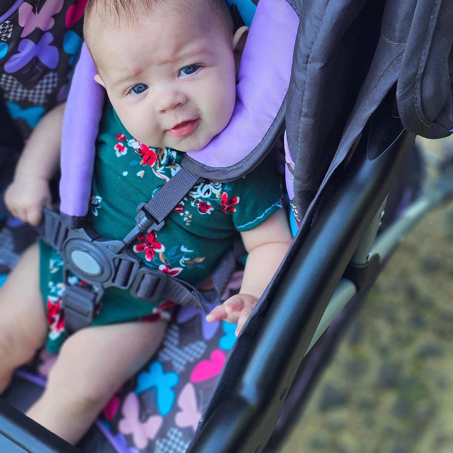 Makayla is registered to the contest to win money with this photo: accessories, baby, car, car_interior, carseat, clothing, dress, face, happy, head, lifejacket, person, photography, portrait, smile, strap, stroller, transportation, vehicle, vest