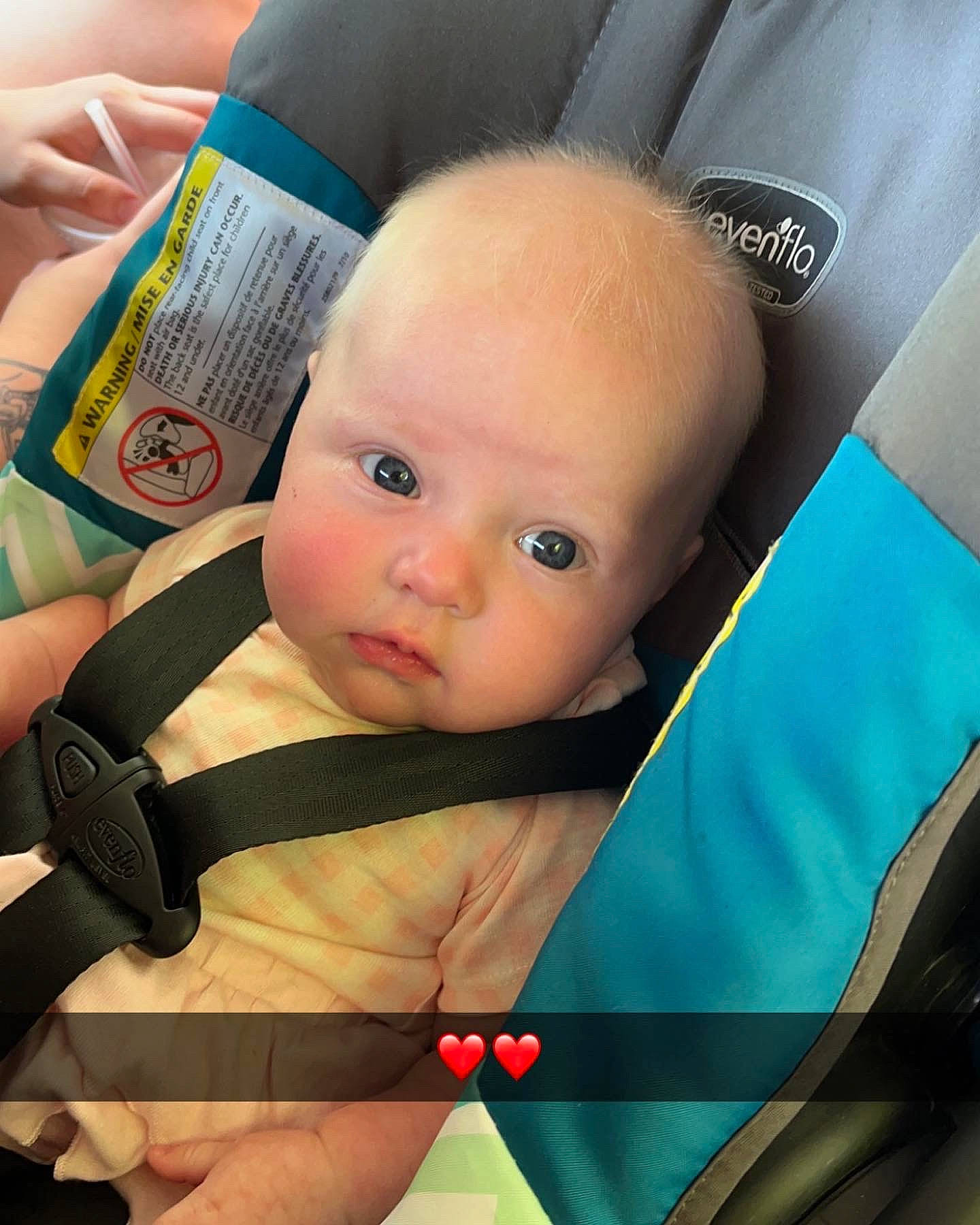 Katie joined the competition — help win amazing prizes! auto_part, baby, baby_carriage, baby_in_car_seat, baby_products, baby_safety, baby_toddler_clothing, car_seat, cheek, comfort, facial_expression, finger, hairstyle, iris, person, product, seat_belt, sitting, skin, thigh