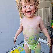 Jayden Blodgett joined the competition — help win amazing prizes! toddler, child, curly_hair, diaper, chalk_paint, colorful, smiling, outdoor, concrete_floor, stencils, chalk, playful, happy, bare_chest, feet, door, pump, hand_painted, messy, fun
