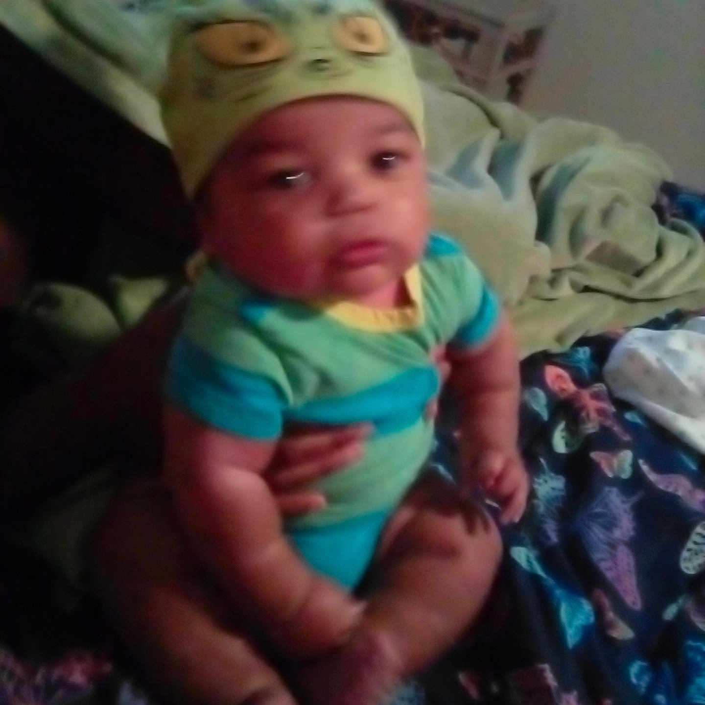 Yurie joined the competition — help win amazing prizes! baby, bed, blanket, blue, butterfly, child, clothing, cute, green, hand, hat, indoor, infant, outdoor, pattern, person, sitting, soft, support, young